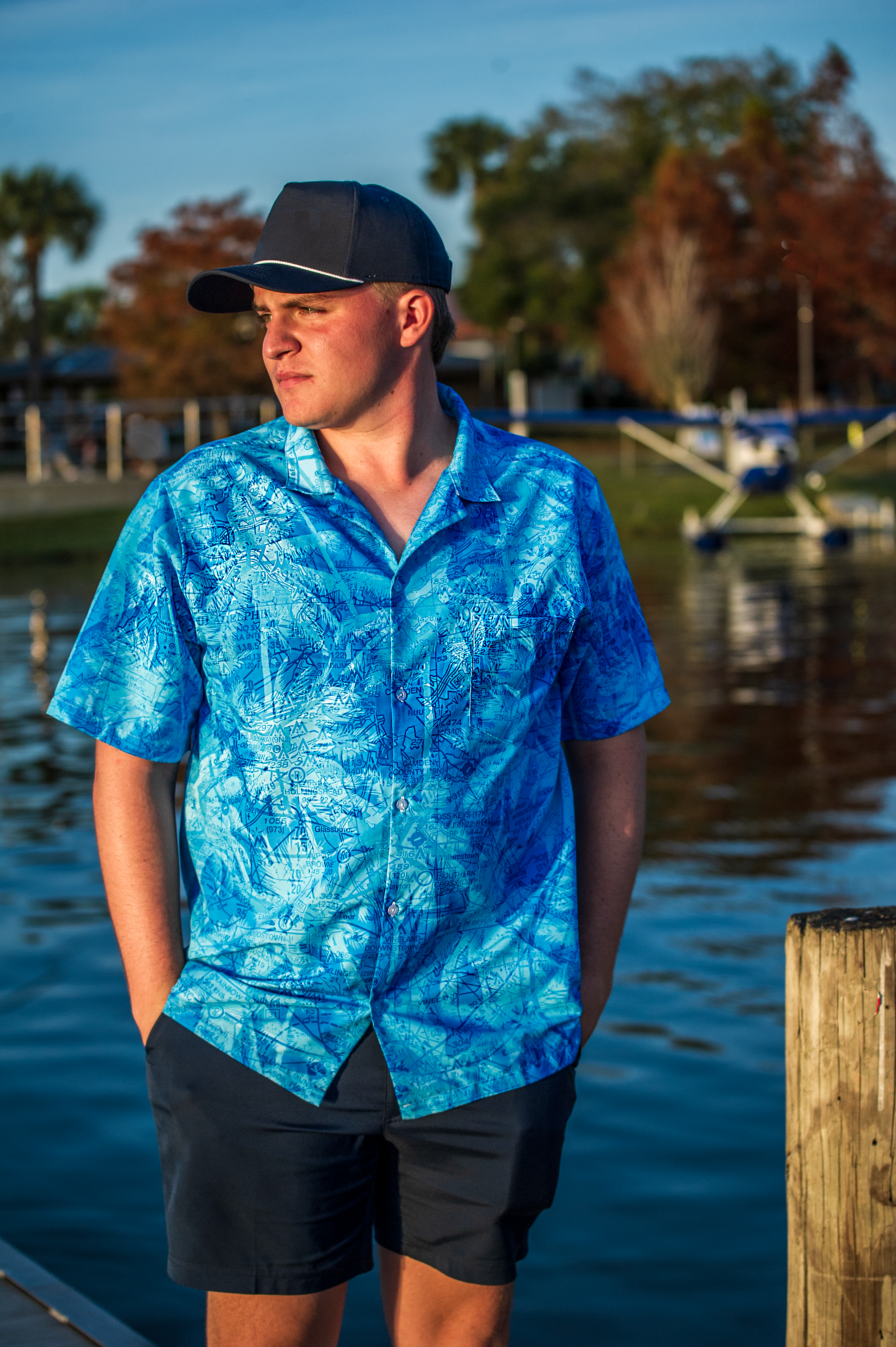 seaplane pilot wearing blue hawaiian print shirt 