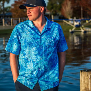 seaplane pilot wearing blue hawaiian print shirt 